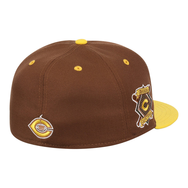 The Cordoba Cafeteros EFF DNA Fitted Ballcap by EFF is a vintage-inspired brown cap with yellow accents, patches on the side and back, a circular logo, yellow top button, and a yellow flat brim.