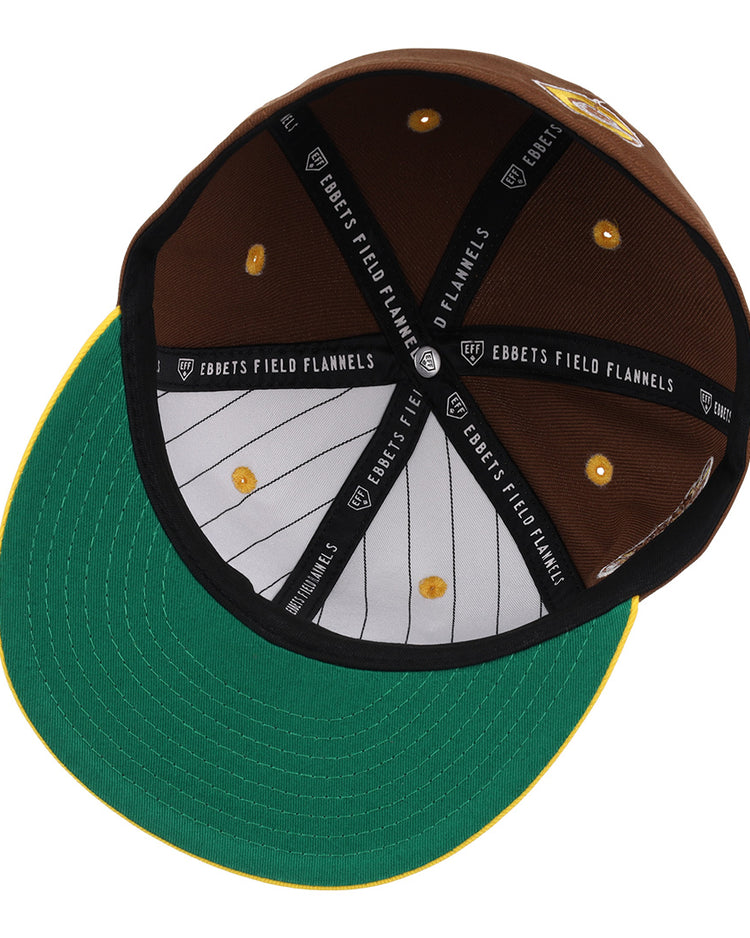 The Cordoba Cafeteros EFF DNA Fitted Ballcap by EFF features brown fabric, a green underbrim, striped white lining, and interior black bands with the Ebbets Field Flannels label—paying homage to classic Mexican League style.