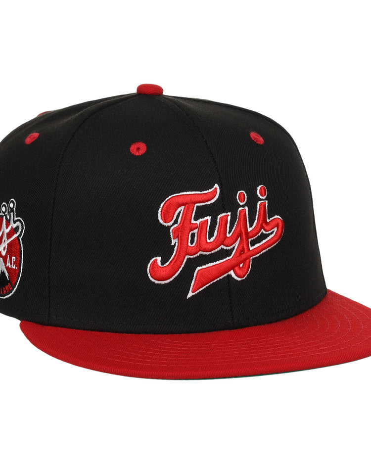 The Fuji Athletic Club EFF DNA Fitted Ballcap by EFF is a vintage-inspired black and red cap featuring bold Fuji embroidery, a round Fuji A.C. logo patch on the side, and a striking red brim and button.