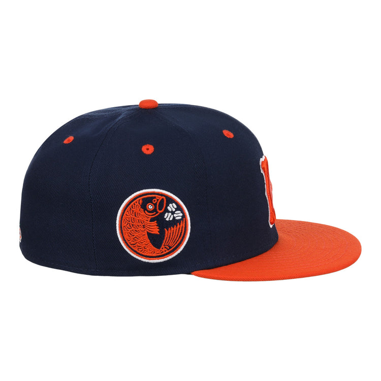 The Hiroshima Carp EFF DNA Fitted Ballcap by EFF features a navy vintage design with an orange brim and an embroidered orange and black fish logo, inspired by the iconic Hiroshima Carp style.