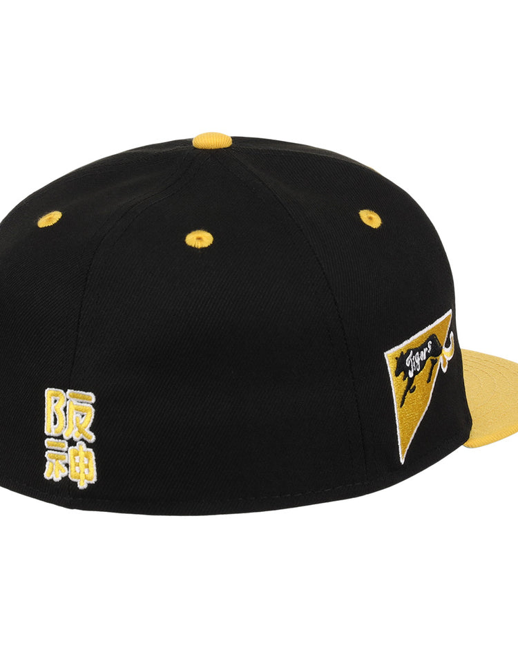 The Osaka Tigers EFF DNA Fitted Ballcap by EFF features a black and yellow vintage design, embroidered Japanese characters, a yellow bill, and Tigers with a tiger graphic—ideal for Japanese baseball fans and Ebbets Field Flannels lovers.