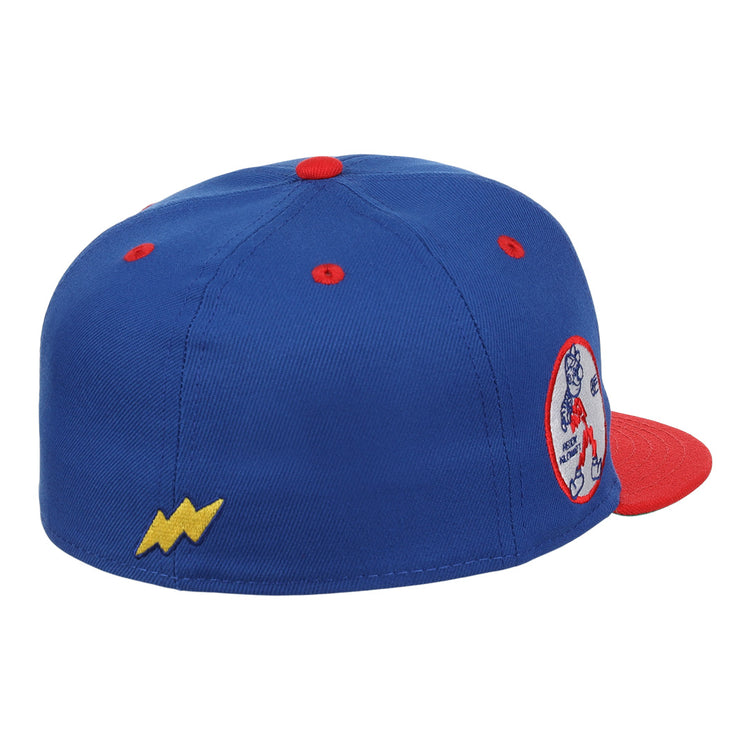 The Reddy Kilowatt EFF DNA Fitted Ballcap by EFF is a blue vintage cap with a red brim and button, featuring a yellow lightning bolt on the side and a round Reddy Kilowatt patch on the back.