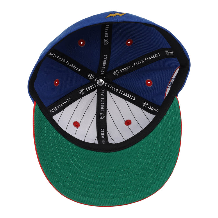 The Reddy Kilowatt EFF DNA Fitted Ballcap by EFF features a blue crown, green undervisor, red trim, black Ebbets Field Flannels branding inside, and a white pinstriped lining with red stitching.