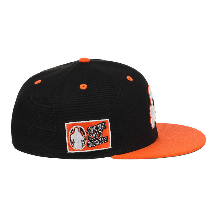 The Sioux City Ghosts EFF DNA Fitted Ballcap by EFF is a vintage-inspired black cap with an orange visor and button, plus a side patch reading SHOCK THE CULT GANGS, reminiscent of classic Ebbets Field Flannels styles.