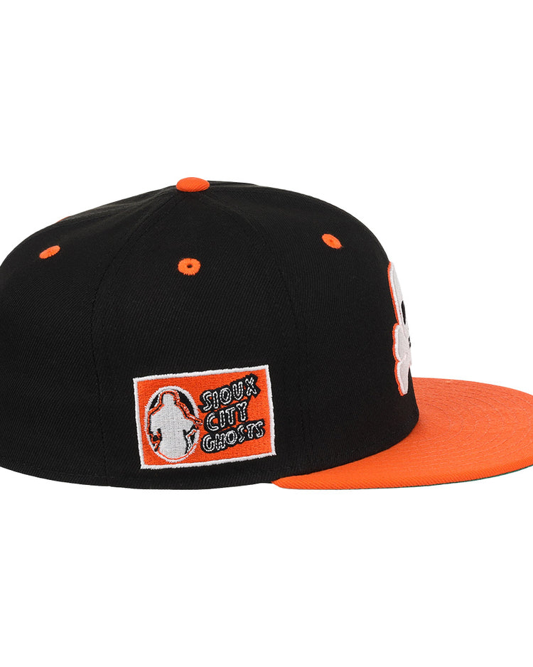 The Sioux City Ghosts EFF DNA Fitted Ballcap by EFF is a vintage-inspired black cap with an orange visor and button, plus a side patch reading SHOCK THE CULT GANGS, reminiscent of classic Ebbets Field Flannels styles.