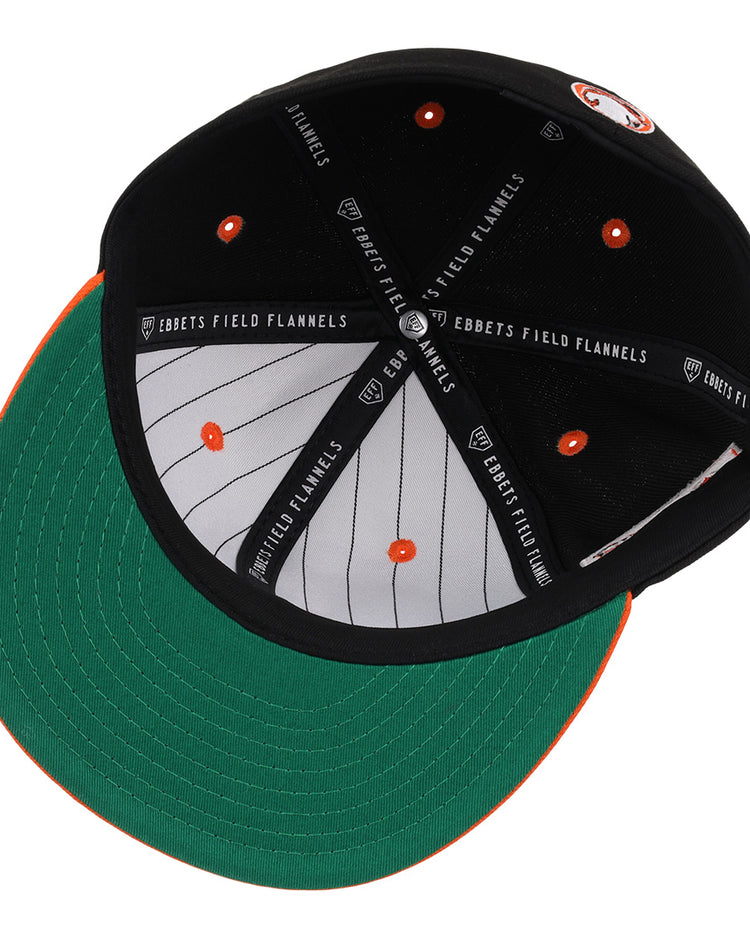 A look inside the Sioux City Ghosts EFF DNA Fitted Ballcap by EFF, featuring a green underbrim, orange accents, white pinstripes, and vintage-inspired style with classic quality details.
