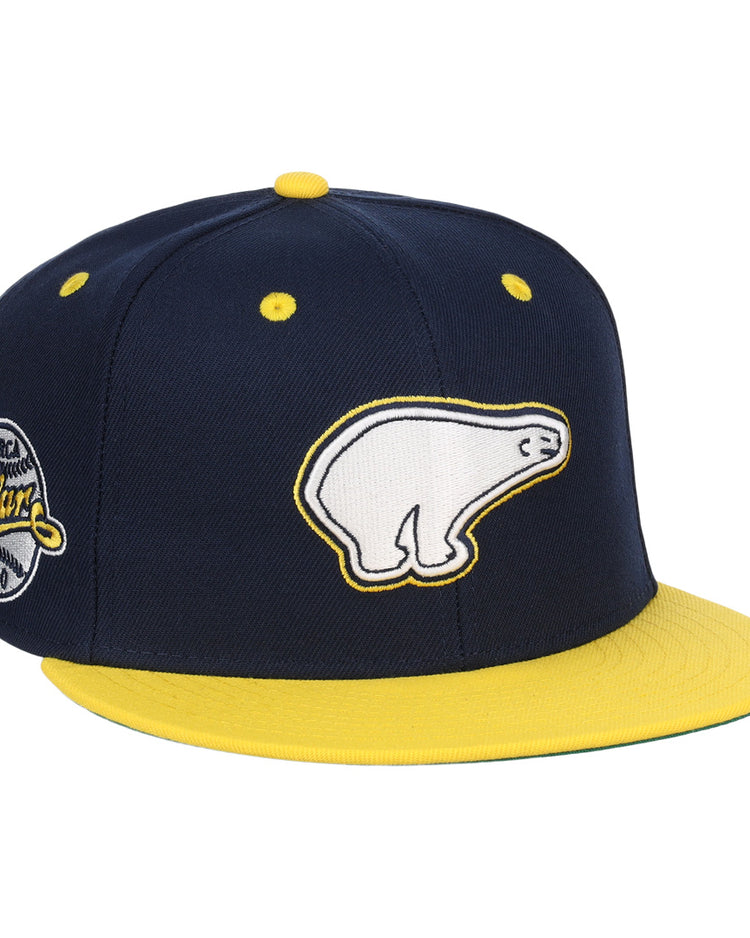 The EFF Cerveceria Polar EFF DNA Fitted Ballcap is a navy blue and yellow vintage-style cap with a white polar bear logo on the front, a Cuban Amateur League patch on the side, and a bright yellow bill and button.