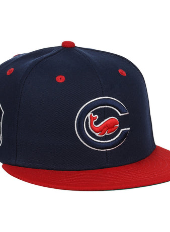 The EFF Chicago Whales EFF DNA Fitted Ballcap is a vintage-inspired navy cap with a red brim, stylized “C” and Whales logo on the front, plus an “FL” shield patch on the side.