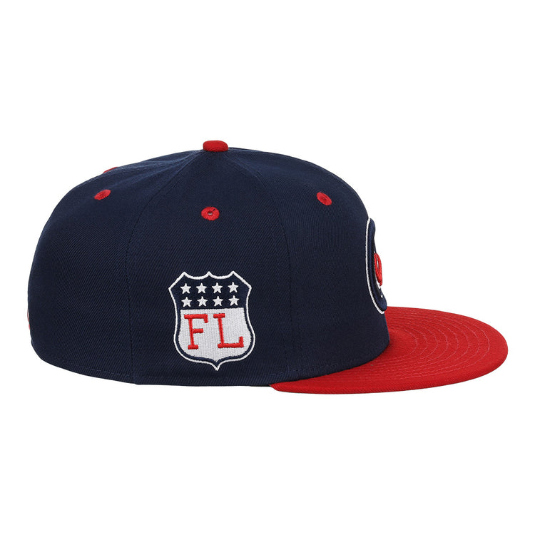 The EFF Chicago Whales DNA Fitted Ballcap features a vintage-inspired navy design with a red brim, button, and eyelets plus a shield patch with stars and “FL” in classic Ebbets Field Flannels style.
