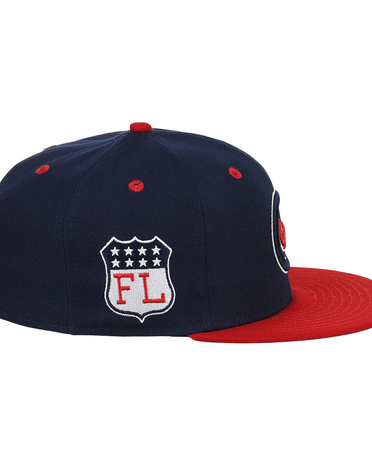 The EFF Chicago Whales DNA Fitted Ballcap features a vintage-inspired navy design with a red brim, button, and eyelets plus a shield patch with stars and “FL” in classic Ebbets Field Flannels style.