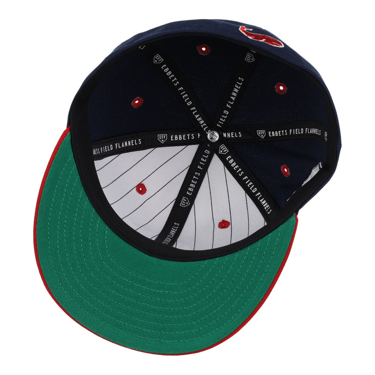 The Chicago Whales EFF DNA Fitted Ballcap from EFF features a vintage look with navy and white panels inside, a green brim with red trim, and black bands printed with “EBBETS FIELD FLANNELS” for classic style.