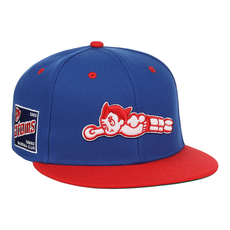 The EFF Sankei Atoms DNA Fitted Ballcap is a blue and red vintage cap with an embroidered Atom Boy flying on the front and a side patch that reads Atoms Baseball Club with the number 4500.