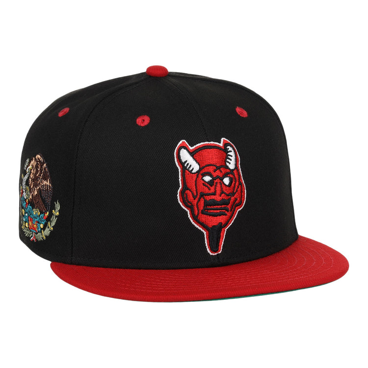 The EFF Mexico Diablos EFF DNA Fitted Ballcap is a black and red hat featuring a red horned devil patch, an embroidered Mexican eagle on the side, and vintage-inspired details in classic Mexican League style.