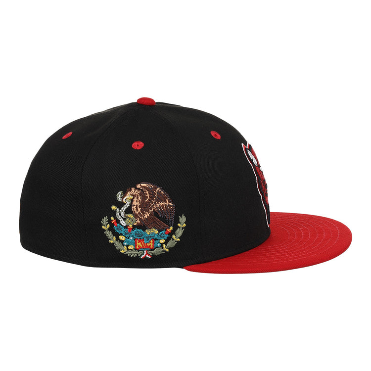 The EFF Mexico Diablos EFF DNA Fitted Ballcap is a black cap with a red brim, featuring an embroidered Mexican eagle on a cactus, inspired by vintage Mexican League styles.