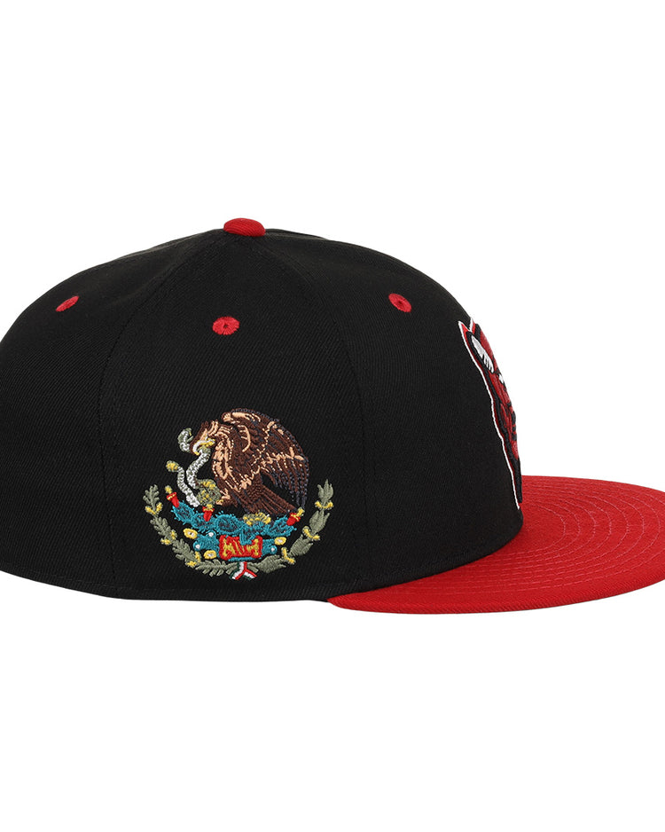 The EFF Mexico Diablos EFF DNA Fitted Ballcap is a black cap with a red brim, featuring an embroidered Mexican eagle on a cactus, inspired by vintage Mexican League styles.