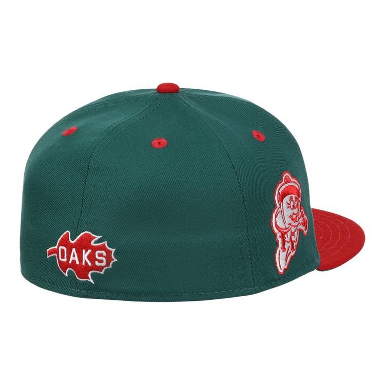 The Oakland Oaks EFF DNA Fitted Ballcap by EFF is a green vintage-inspired cap with a red brim, top button, and eyelets, plus side red oak leaf and OAKS patches with a white-outlined mascot—classic Ebbets Field Flannels style.
