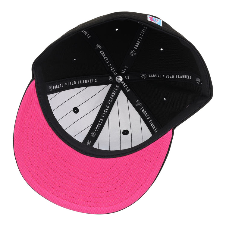 Inside view of the Miami Giants NLB Team Color Fitted Ballcap by EFF: black crown, bright pink brim, gray pinstripe panel, EFF logo taping, and a colorful patch on the inner back.