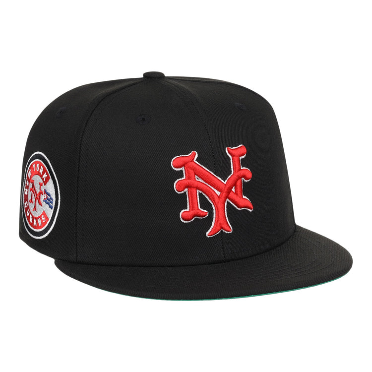 The EFF New York Cubans NLB Team Color Fitted Ballcap is a vintage-inspired black cap with a 3D red NY logo on the front and a round New York Giants patch on the side.