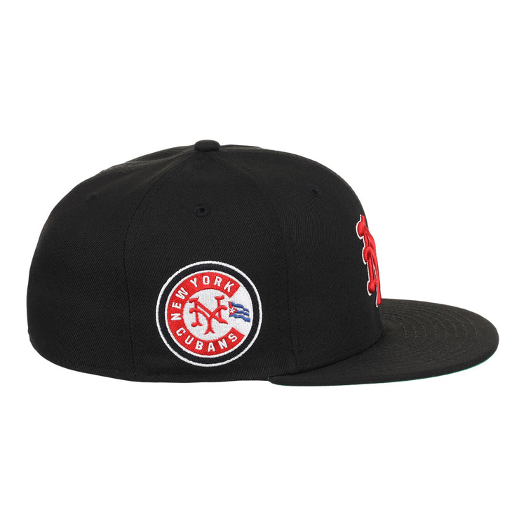 The EFF New York Cubans NLB Team Color Fitted Ballcap is a black vintage-inspired cap with a flat brim, featuring a circular patch reading New York Cubans with a red baseball logo and blue accents, honoring the Negro National League.