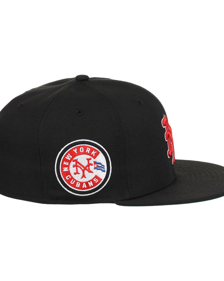 The EFF New York Cubans NLB Team Color Fitted Ballcap is a black vintage-inspired cap with a flat brim, featuring a circular patch reading New York Cubans with a red baseball logo and blue accents, honoring the Negro National League.
