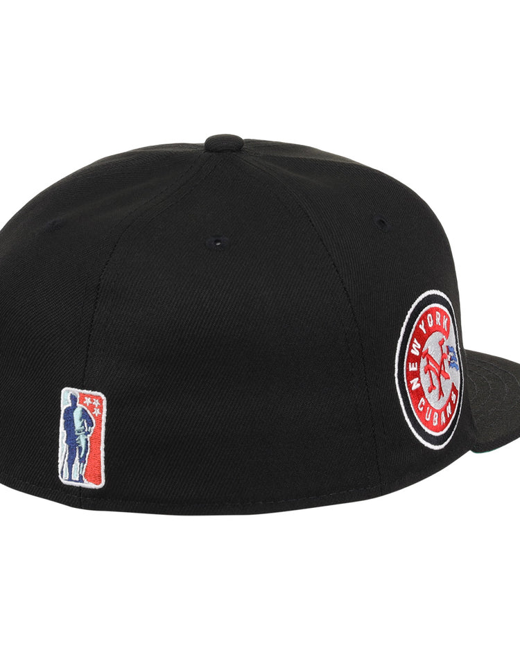 The EFF New York Cubans NLB Team Color Fitted Ballcap is a black cap with a 3D NY logo, honoring the Negro National League with side embroidery and a back patch of a bat-wielding figure.