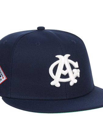 The EFF Chicago American Giants NLB Team Color Fitted Ballcap features a navy crown, flat brim, white AC logo on the front, and a red, white, and blue side patch—perfect for collectors.