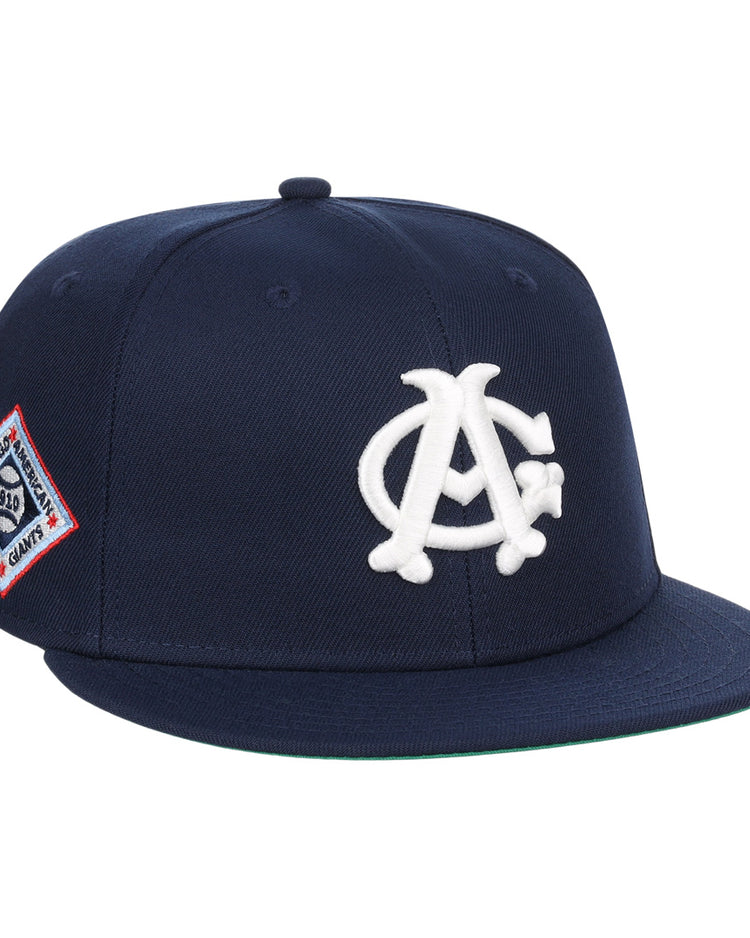 The EFF Chicago American Giants NLB Team Color Fitted Ballcap features a navy crown, flat brim, white AC logo on the front, and a red, white, and blue side patch—perfect for collectors.