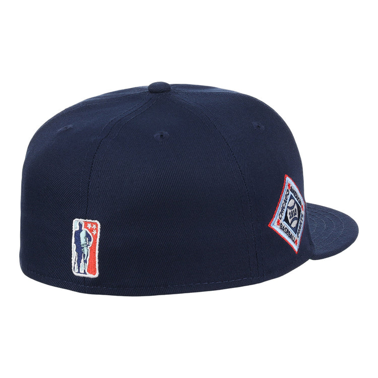 The EFF Chicago American Giants NLB Team Color Fitted Ballcap is a navy blue crown cap with a flat brim, featuring a silhouette logo patch on the back and a diamond-shaped text logo patch on the side, inspired by vintage NLB Flip styles.