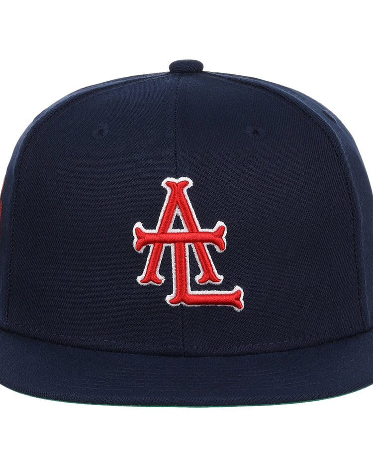 The EFF Atlanta Black Crackers NLB Team Color Fitted Ballcap is a vintage-inspired navy hat with a red and white interlocking A and L logo embroidered on the front and a flat brim, featuring no visible branding besides the striking front logo.