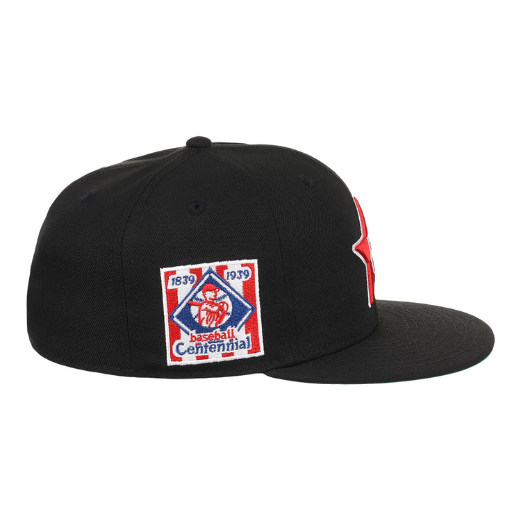 The EFF Philadelphia Stars NLB Team Color Fitted Ballcap is a black flat-brim cap with an embroidered Star logo, plus a side patch reading 1839 1939 Baseball Centennial with a red baseball figure, honoring the Negro National League.