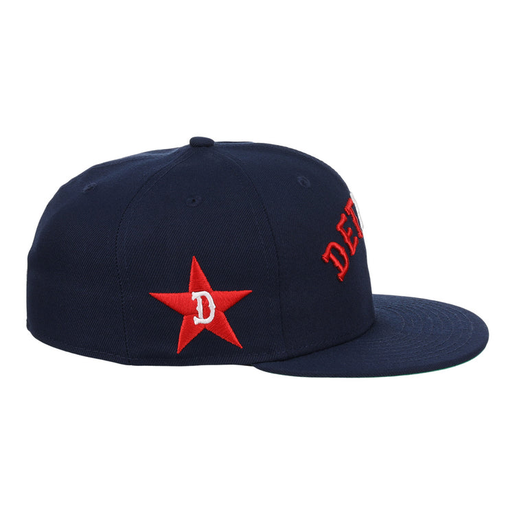 The EFF Detroit Stars NLB Team Color Fitted Ballcap is a vintage-inspired navy cap with a red embroidered star, D on the side, and partial red DET lettering on the front.
