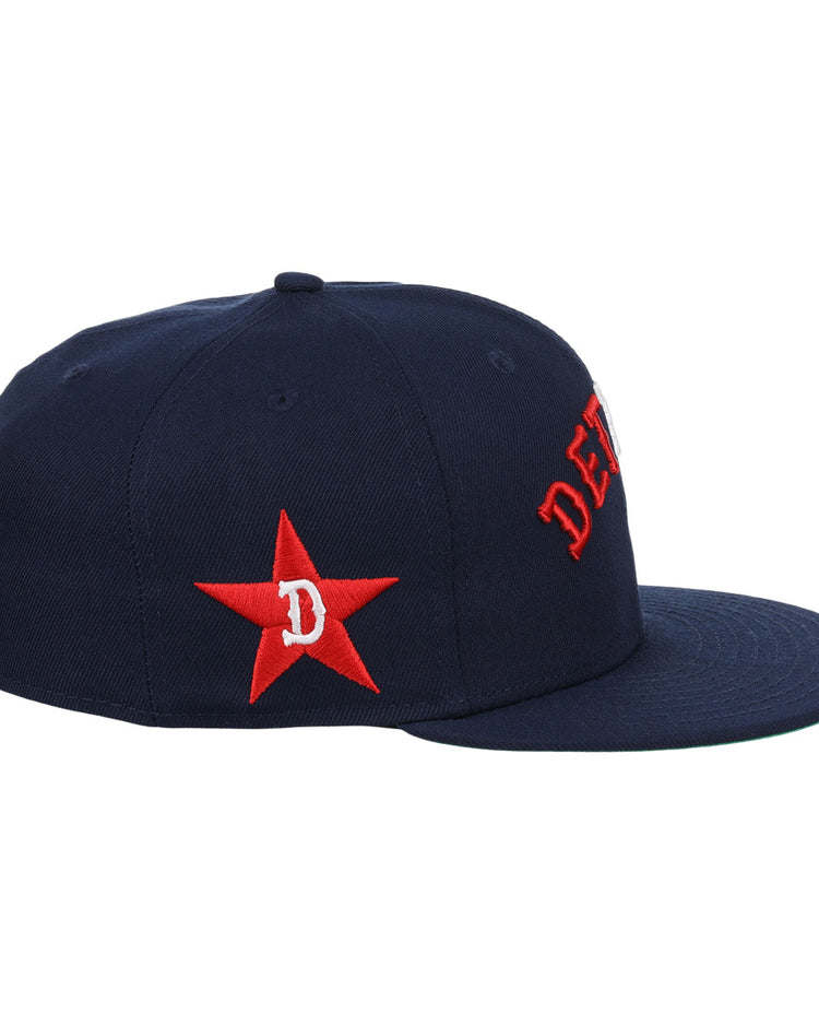 The EFF Detroit Stars NLB Team Color Fitted Ballcap is a vintage-inspired navy cap with a red embroidered star, D on the side, and partial red DET lettering on the front.