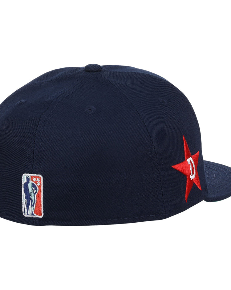 The EFF Detroit Stars NLB Team Color Fitted Ballcap in navy features a red star with a white D on the side and an NBA logo patch, perfect for fans of classic Detroit Stars style.