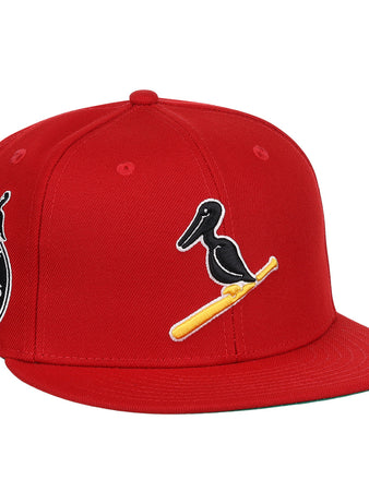 The EFF New Orleans Black Pelicans NLB Team Color Fitted Ballcap in red features a black pelican on a yellow bat, a side patch with New Orleans Black Pelicans 1922, and honors the Negro Southern League with an added small pelican graphic.