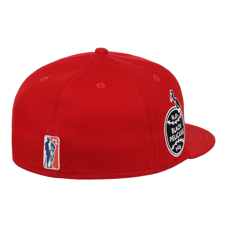 The EFF New Orleans Black Pelicans NLB Team Color Fitted Ballcap in red features a round black-and-white side patch, an embroidered bat-wielding silhouette near the back, flat brim, visible stitching, and Negro Southern League heritage.