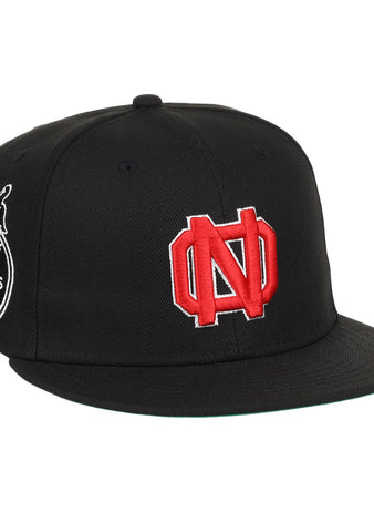 The EFF New Orleans Black Pelicans NLB Team Color Fitted Ballcap in black features a large red and white ND logo on the front and a round side patch with a pelican, inspired by classic Negro Southern League style.