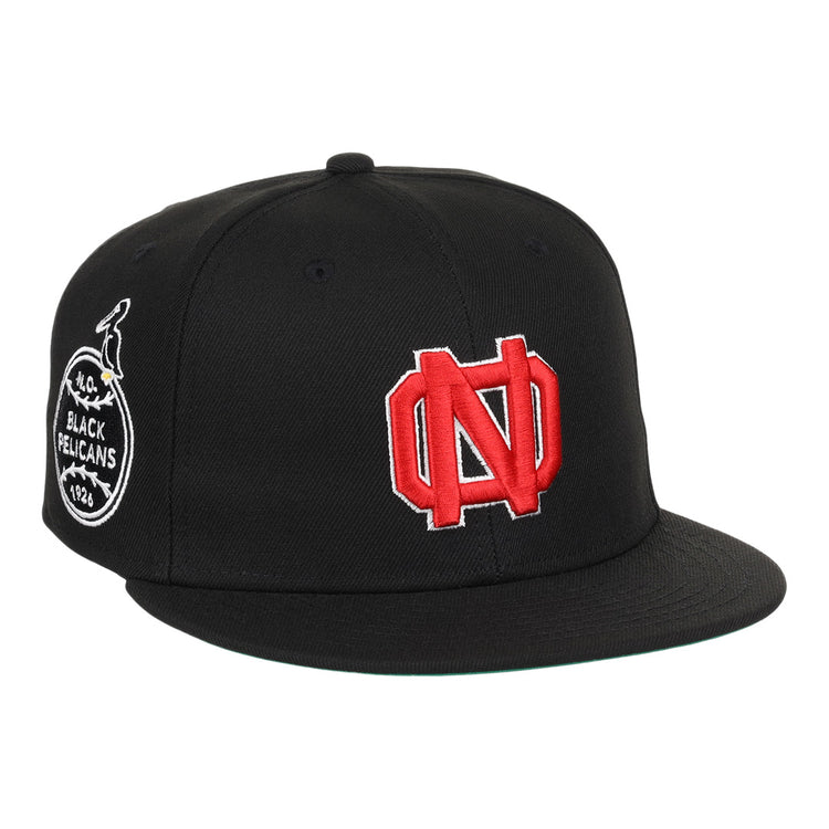 The EFF New Orleans Black Pelicans NLB Team Color Fitted Ballcap in black features a large red and white ND logo on the front and a round side patch with a pelican, inspired by classic Negro Southern League style.