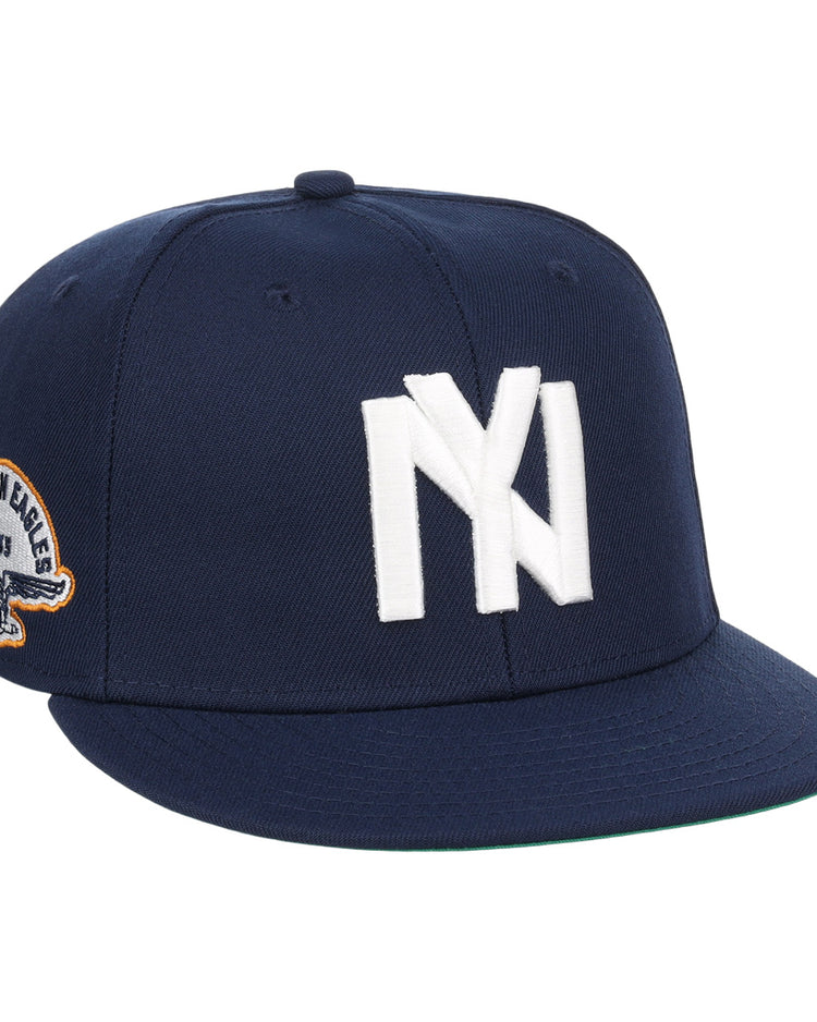 The EFF Brooklyn Eagles NLB Team Color Fitted Ballcap is a navy blue cap with a bold white NY logo on the front and a side eagle patch displaying 1993 and BKLYN EAGLES.