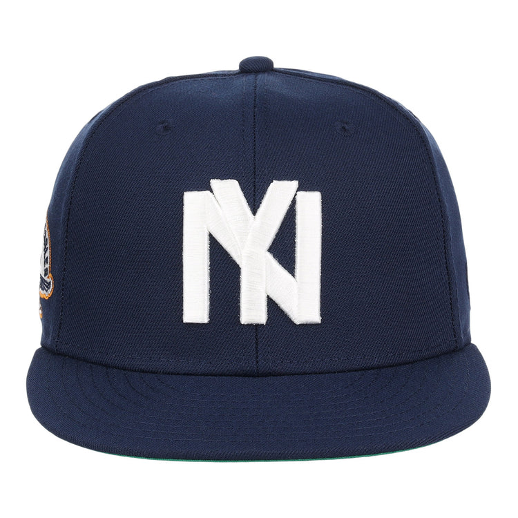 The EFF Brooklyn Eagles NLB Team Color Fitted Ballcap is a navy cap with a large white NY logo on the front, a flat brim, and a small patch on the left side.