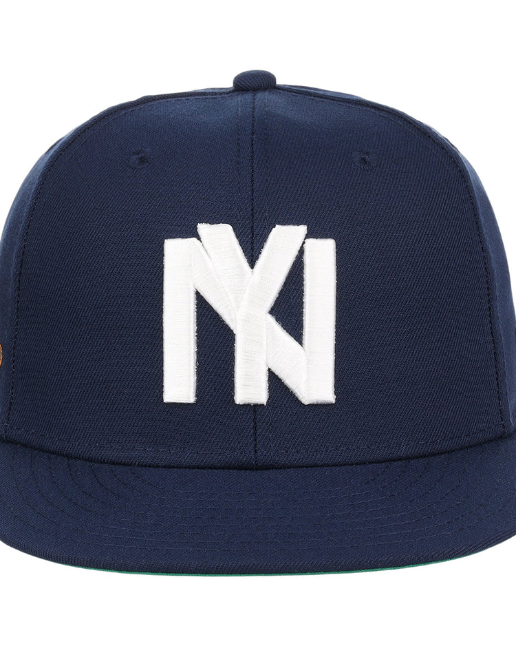 The EFF Brooklyn Eagles NLB Team Color Fitted Ballcap is a navy cap with a large white NY logo on the front, a flat brim, and a small patch on the left side.