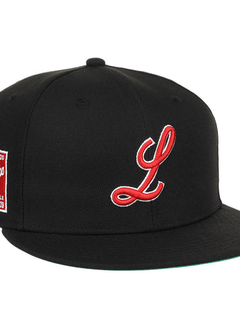 The EFF Louisville Black Caps NLB Team Color Fitted Ballcap is a black vintage-inspired hat featuring a red and white L and a Louisville Baseball Club patch, honoring the Negro National League era.