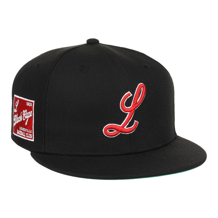 The EFF Louisville Black Caps NLB Team Color Fitted Ballcap is a black vintage-inspired hat featuring a red and white L and a Louisville Baseball Club patch, honoring the Negro National League era.