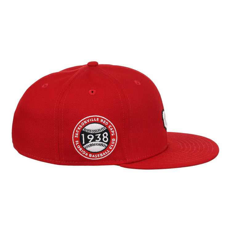 The EFF Jax Red Caps NLB Team Color Fitted Ballcap features a flat brim, a bold 3D embroidered logo, and a circular patch reading Jacksonville Red Caps 1938 Colored Baseball Club, honoring the Negro American League.