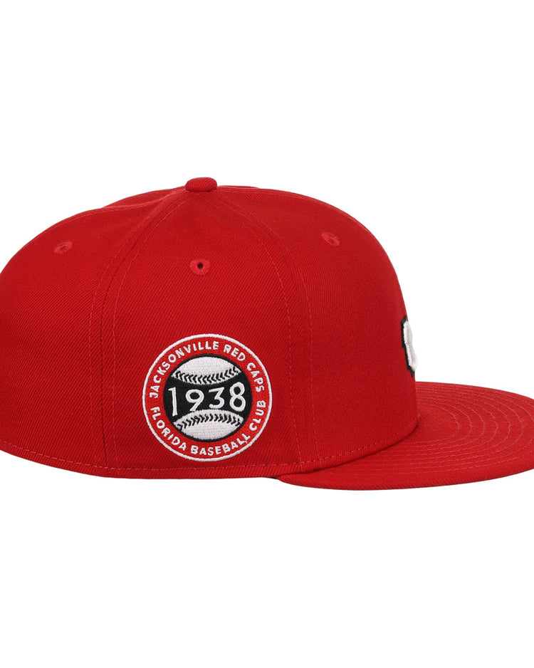 The EFF Jax Red Caps NLB Team Color Fitted Ballcap features a flat brim, a bold 3D embroidered logo, and a circular patch reading Jacksonville Red Caps 1938 Colored Baseball Club, honoring the Negro American League.