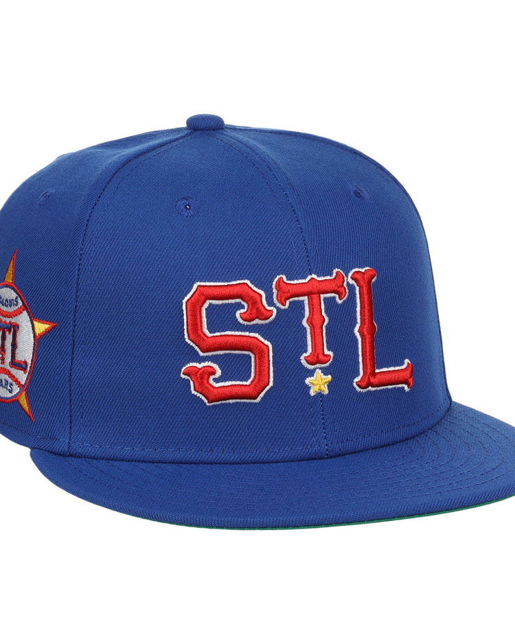 The EFF St. Louis Stars NLB Team Color Fitted Ballcap features bold red and white STL letters with a yellow star, plus a side patch with STL Stars outlined by a red star, inspired by Negro National League vintage caps.