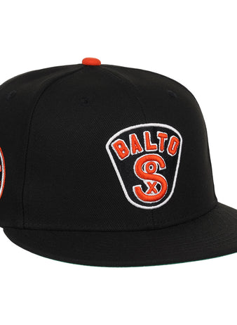 The EFF Baltimore Black Sox NLB Team Color Fitted Ballcap features an embroidered BALTO SOX front logo, a circular Baltimore Black Sox/Eastern Colored League side patch, and orange button and accents for a vintage look.