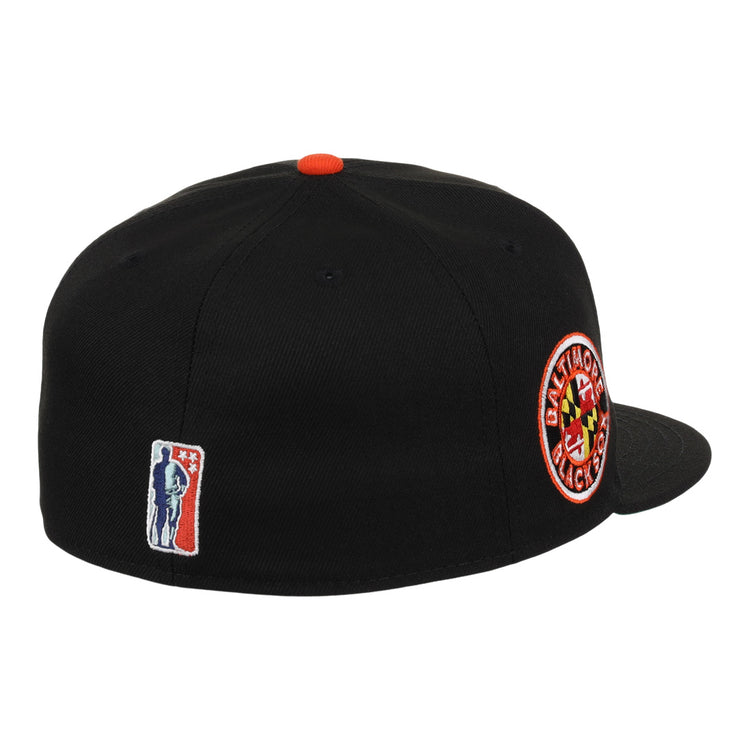 The EFF Baltimore Black Sox NLB Team Color Fitted Ballcap features a vintage look with a circular team patch on the side, red top button, and an embroidered baseball player logo on the back—celebrating Eastern Colored League history.