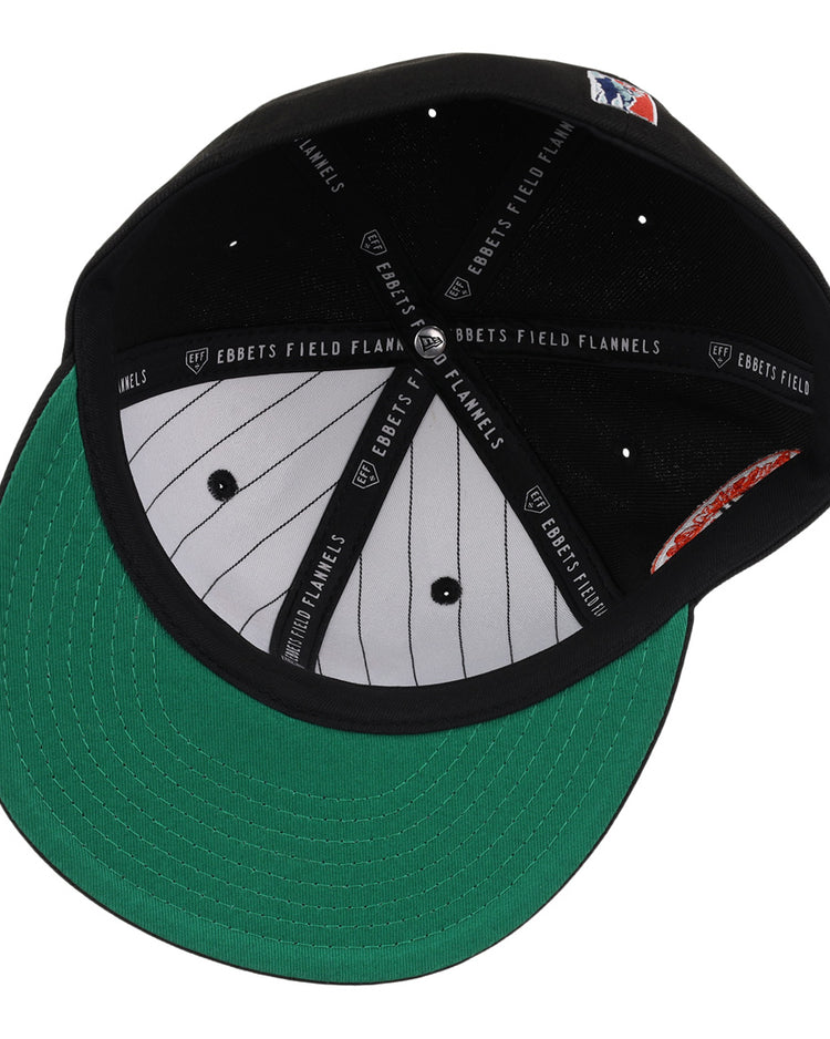 The Baltimore Black Sox NLB Team Color Fitted Ballcap by EFF features a green underbrim, grey pinstriped lining, black sweatband with EFF label, and a small white, red, and blue logo—reflecting classic vintage style.