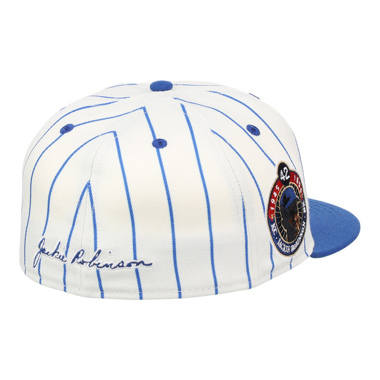 The EFF Jackie Robinson Signature Series Fitted Ballcap - Pinstripe features blue pinstripes, a blue brim, 3D embroidered signature on the side, and a round patch with “42” and Robinson in uniform.