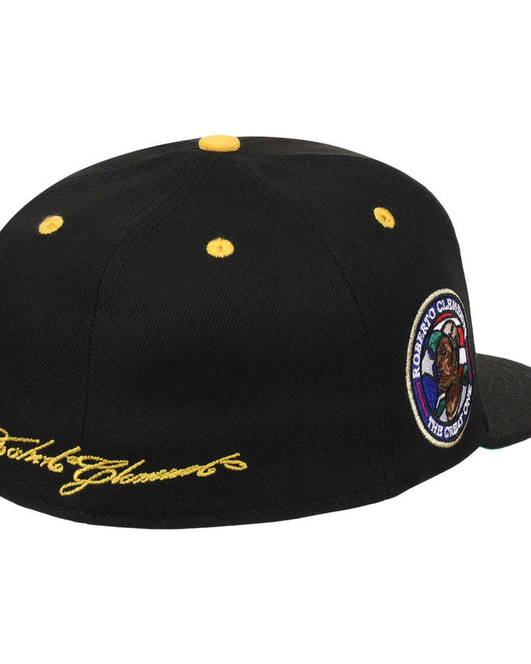 The EFF Roberto Clemente Signature Series Fitted Ballcap in black features yellow embroidery, button, and eyelets, plus a “Roberto Clemente The Great One” patch on the side for standout style.